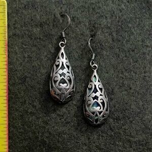 Sterling silver open scrollwork earrings with abalone back
